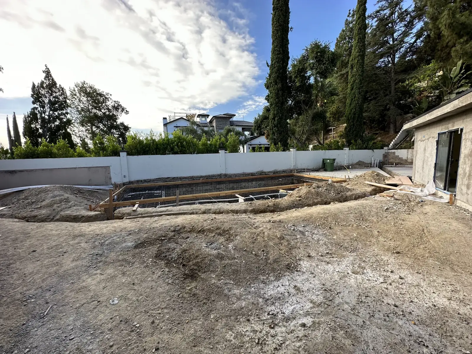 Pool excavation on the hillside lot