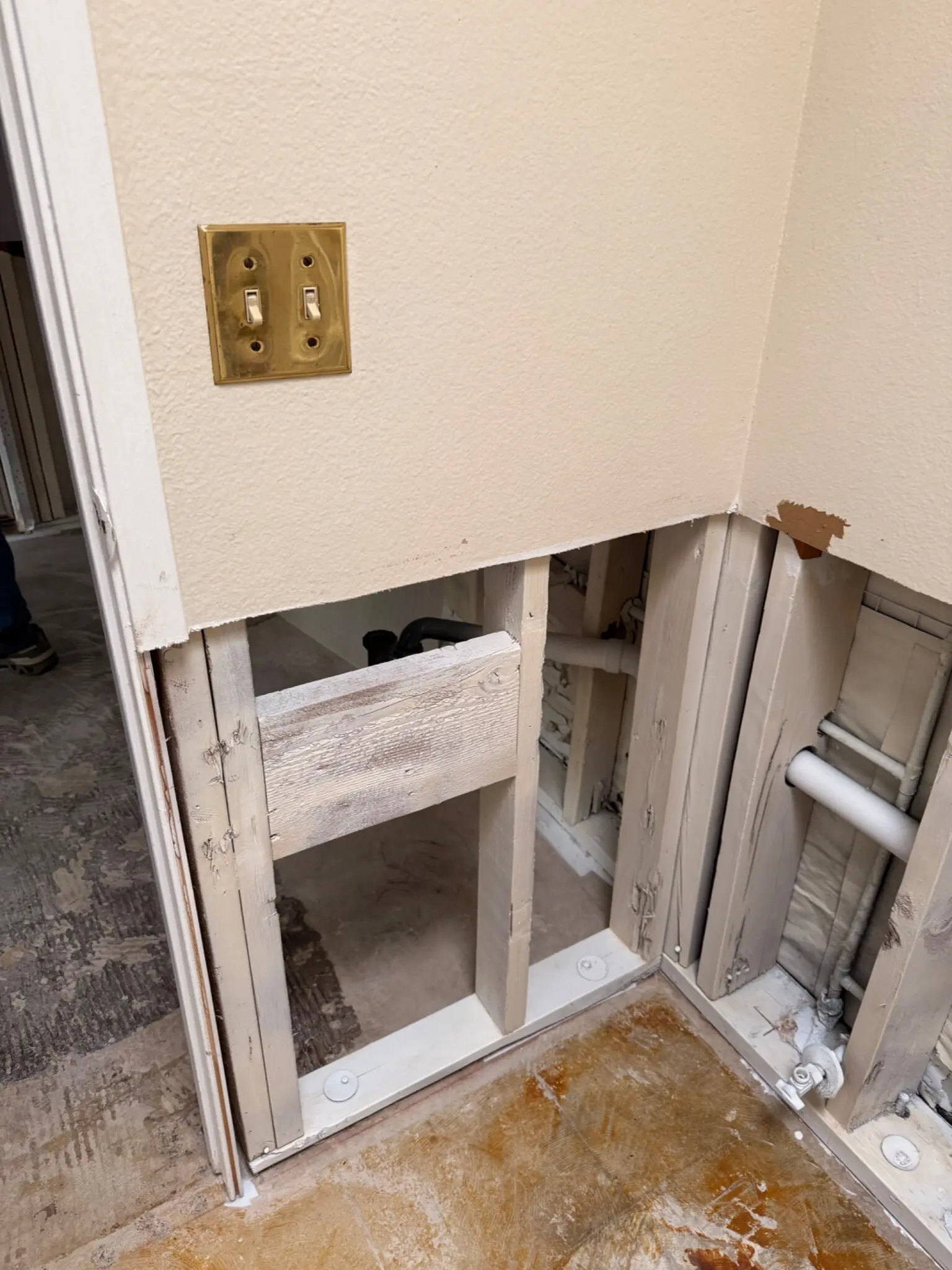 Wall opened for flood-damage investigation and repair in the Irvine condominium
